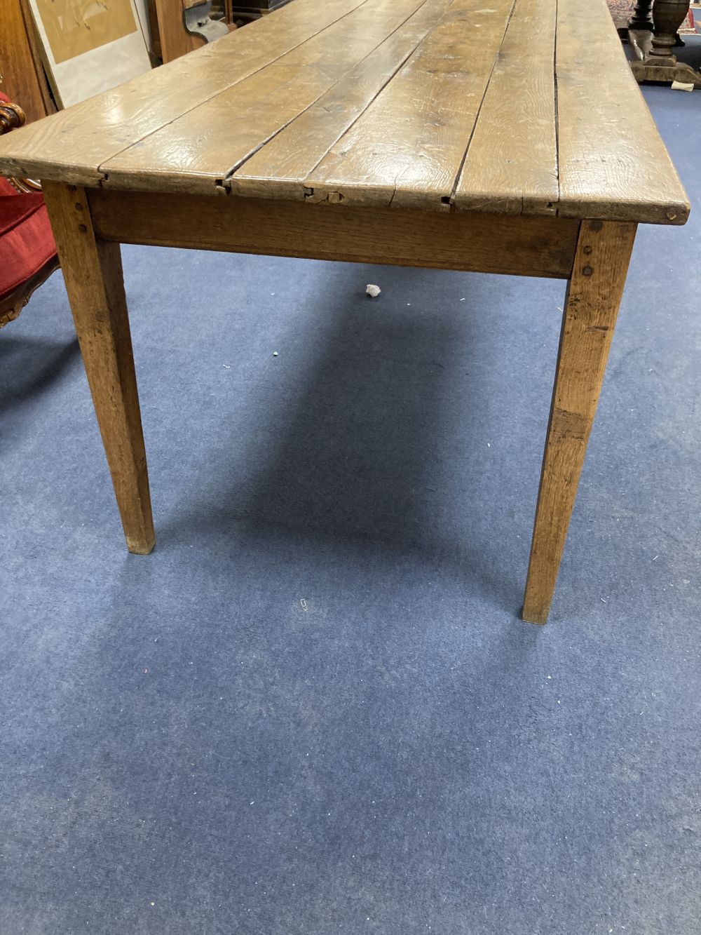A 19th century French oak and elm farmhouse kitchen table, width 203cm depth 82cm height 73cm